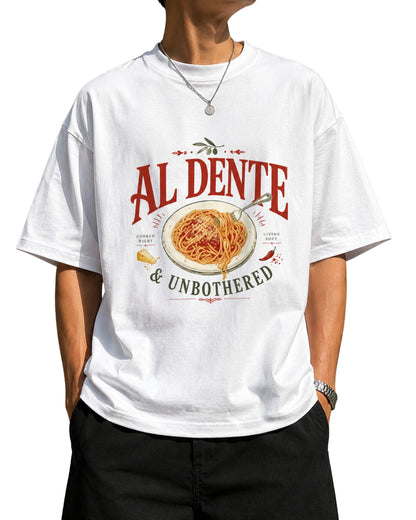 "Oversized White graphic t-shirt featuring a detailed vintage-style illustration of spaghetti on a plate with a fork, parmesan cheese, and a chili pepper, with the text 'AL DENTE' in bold and '& UNBOTHERED"