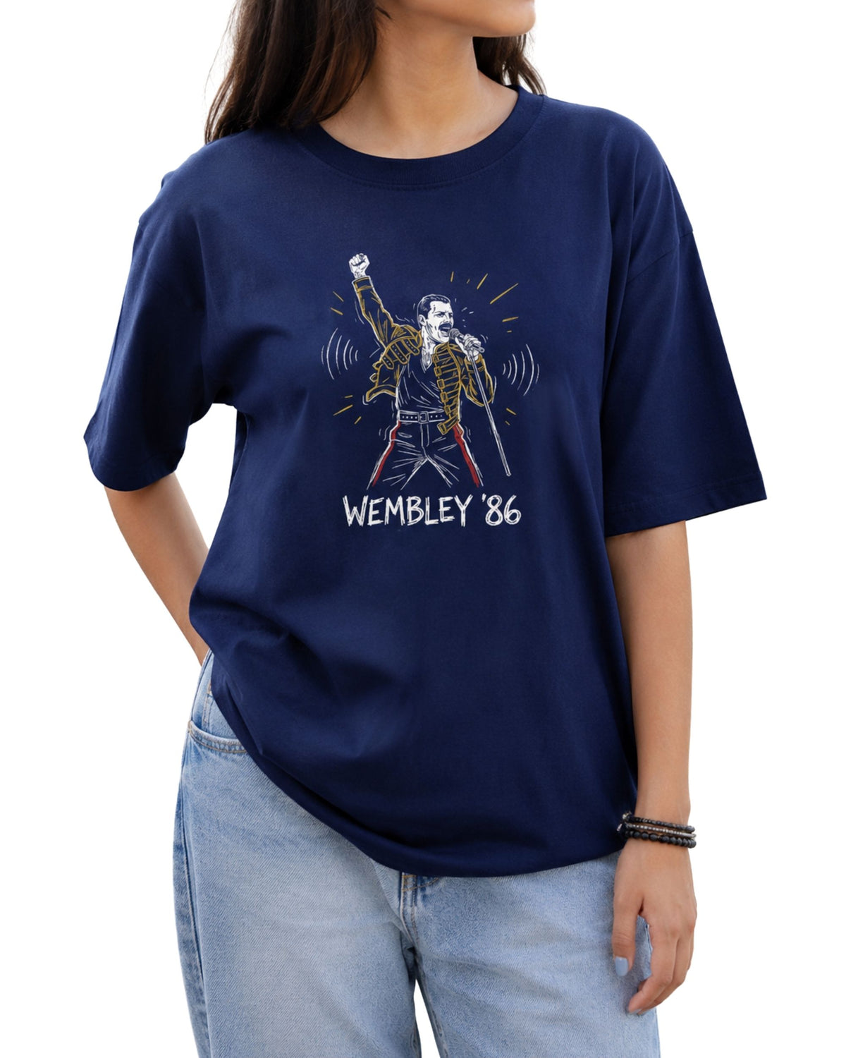 Graphic T-shirt featuring a hand-drawn concert-inspired singer illustration with a raised fist, microphone,jacket, and “Wembley ’86” text below Royal Blue