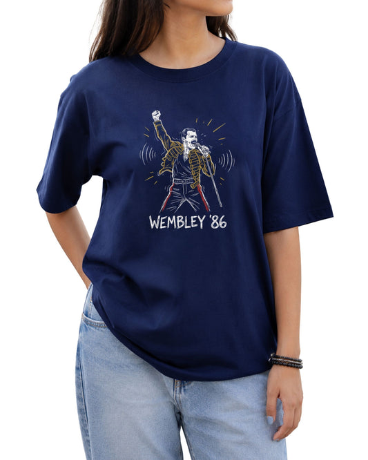 Graphic T-shirt featuring a hand-drawn concert-inspired singer illustration with a raised fist, microphone,jacket, and “Wembley ’86” text below Royal Blue