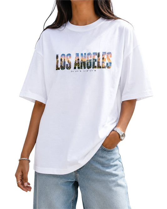 Los Angeles cityscape oversized graphic T-shirt design with watercolor typography, Hollywood Hills, palm trees, LA skyline and California beach scenery White
