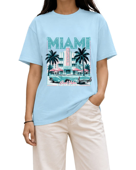 Young woman wearing a baby blue regular-fit Miami graphic T-shirt.