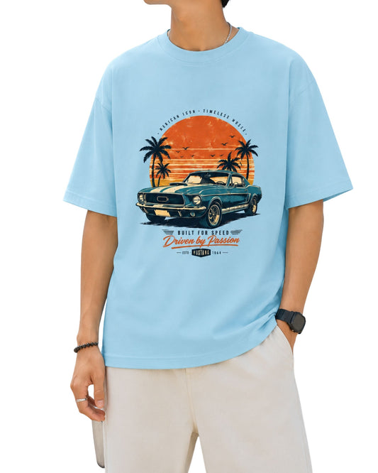 Vintage car graphic T-shirt design with a classic muscle car, retro sunset, palm trees and Built for Speed typography baby blue