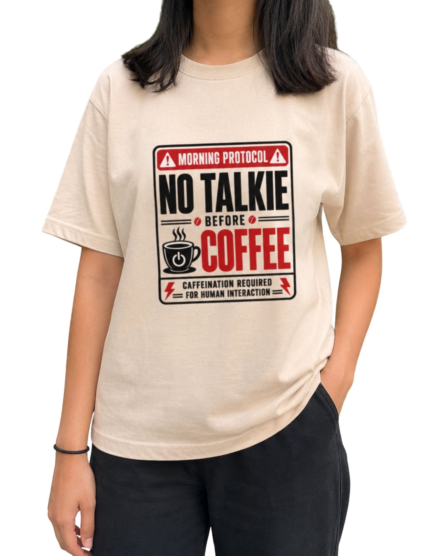 No Talkie Before Coffee unisex oversized graphic T-shirt with bold red, black and white coffee-themed typography and caffeine-inspired artwork by Coreteez Peach