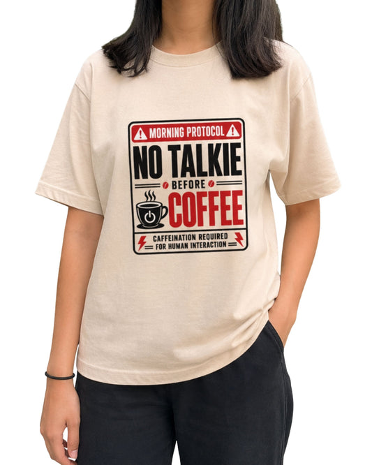 No Talkie Before Coffee unisex oversized graphic T-shirt with bold red, black and white coffee-themed typography and caffeine-inspired artwork by Coreteez Peach