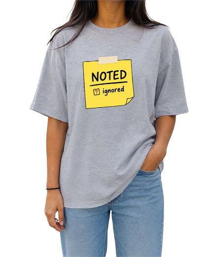 Noted Ignored yellow sticky note graphic printed on a unisex oversized T-shirt by Coreteez grey melange