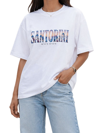 Santorini Greece travel graphic oversized T-shirt with artistic destination typography and Mediterranean-inspired design by Coreteez White