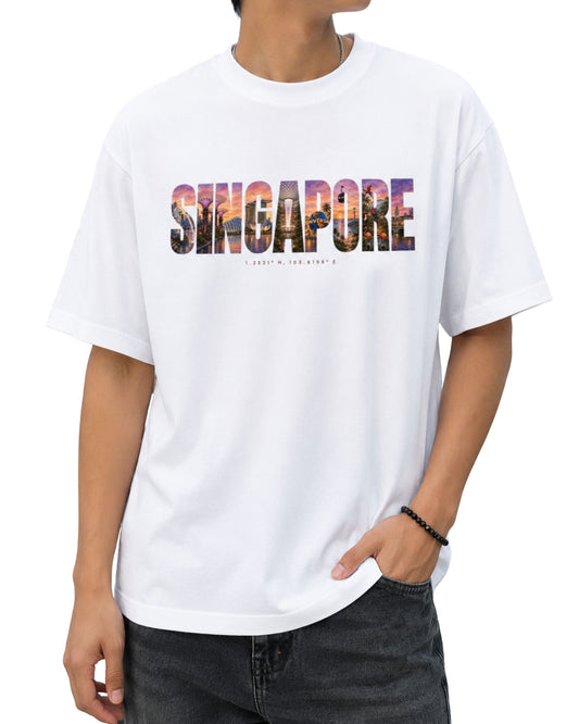 Singapore travel typography graphic T-shirt design with colourful sunset-inspired city artwork and coordinates, created for a unisex oversized tee white