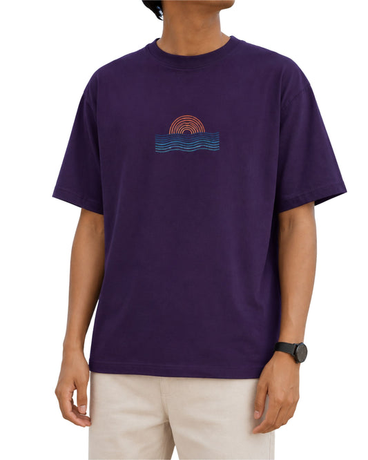 Retro sunset and ocean waves graphic T-shirt with sun arches and wave lines in a minimalist coastal design purple