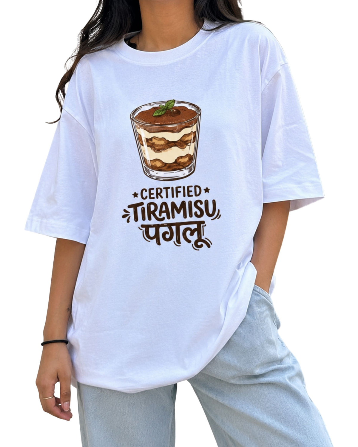 White oversized T-shirt with a playful “Certified Tiramisu Paglu” graphic, featuring an illustrated tiramisu dessert.