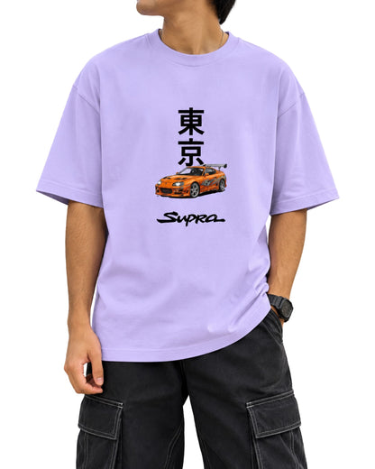 oversized graphic T-shirt with bold Japanese Tokyo typography, an JDM-inspired sports car illustration, and brush-style Supra text on the front lavender