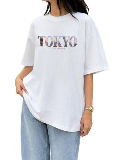 Tokyo travel-inspired graphic oversized T-shirt with artistic city artwork and coordinates, inspired by the dreamy urban mood and vibrant energy of Tokyo, Japan White