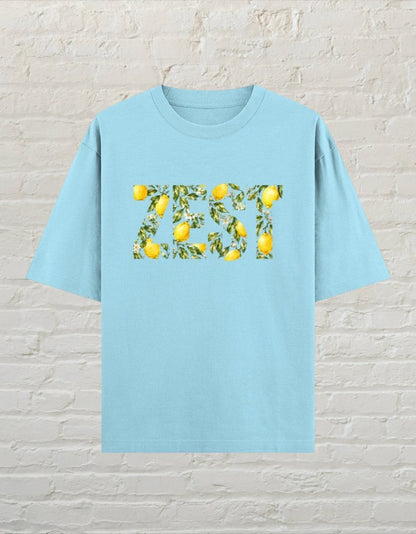 CoreTeez baby blue oversized unisex t-shirt featuring a ZEST graphic with lemon and leaf print