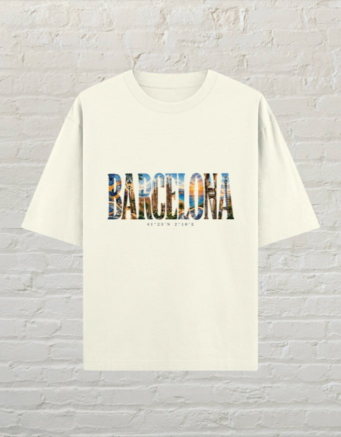CoreTeez unisex oversized off white cotton t-shirt featuring a Barcelona graphic print with city imagery