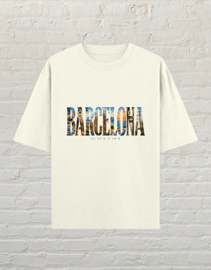CoreTeez unisex oversized off white cotton t-shirt featuring a Barcelona graphic print with city imagery