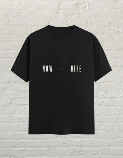 CoreTeez black unisex cotton t-shirt featuring a minimalist Now Here graphic print.