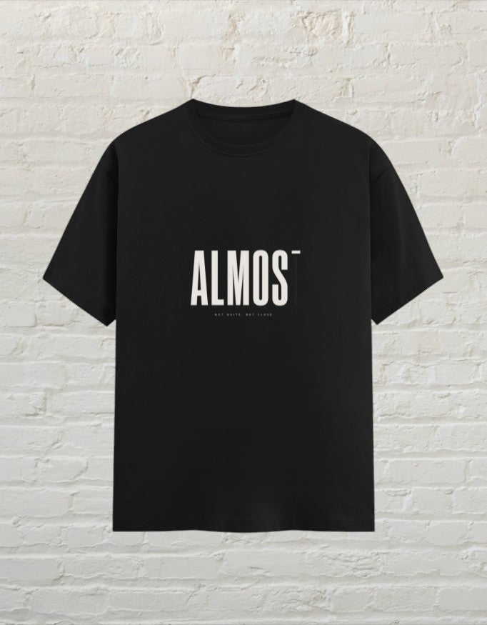 CoreTeez black unisex crew neck t-shirt made of 100% cotton featuring a minimalist ALMOST graphic print.