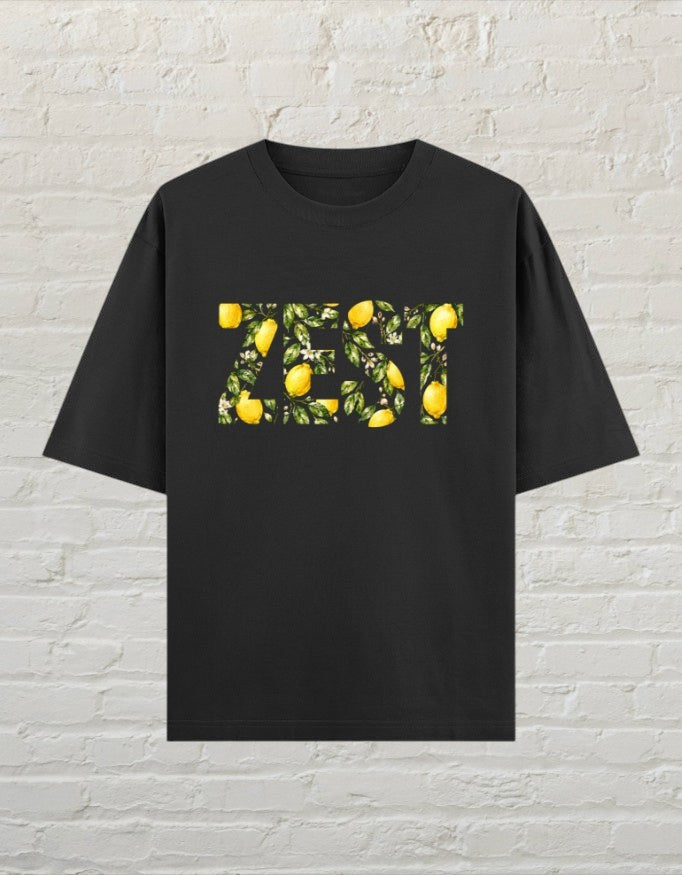CoreTeez black oversized unisex t-shirt featuring a ZEST graphic filled with lemons and leaves