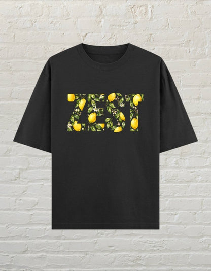 CoreTeez black oversized unisex t-shirt featuring a ZEST graphic filled with lemons and leaves