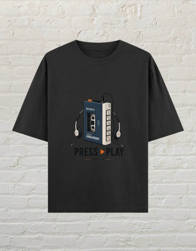 CoreTeez black oversized cotton t-shirt featuring a retro cassette player graphic and Press Play text