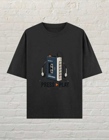CoreTeez black oversized cotton t-shirt featuring a retro cassette player graphic and Press Play text