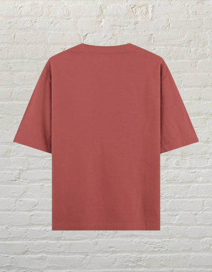 CoreTeez unisex oversized cotton t-shirt in a coral colour, shown from the back.