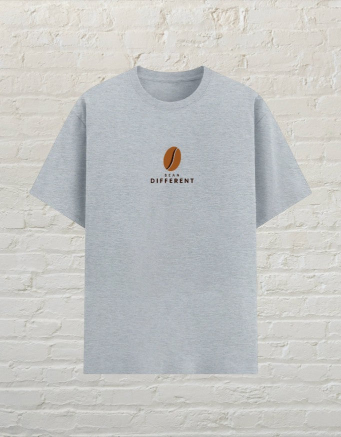 CoreTeez unisex grey melange poly-cotton t-shirt featuring a small brown coffee bean graphic and Bean Different text
