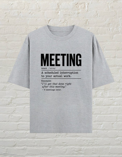 CoreTeez grey melange oversized cotton unisex t-shirt featuring a humorous dictionary-style meeting definition graphic