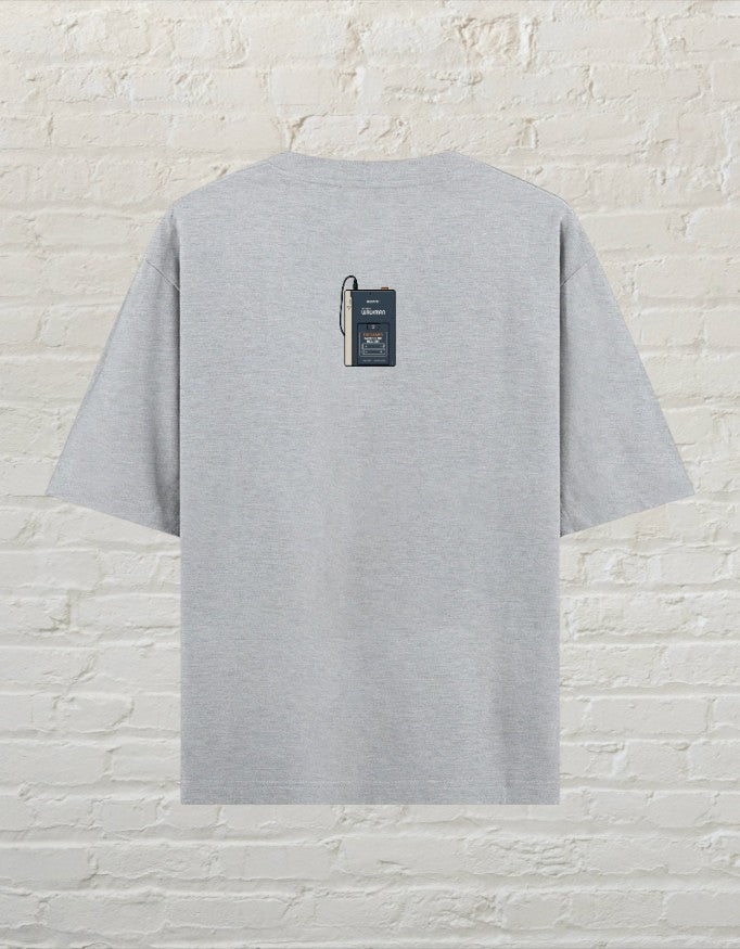 CoreTeez grey melange oversized cotton t-shirt featuring a small vintage cassette player graphic on the back