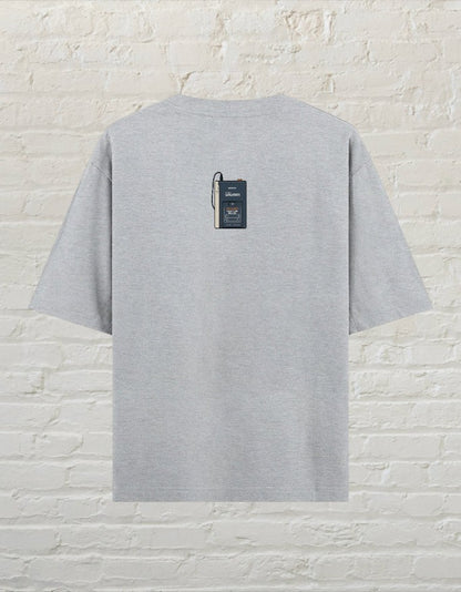 CoreTeez grey melange oversized cotton t-shirt featuring a small vintage cassette player graphic on the back