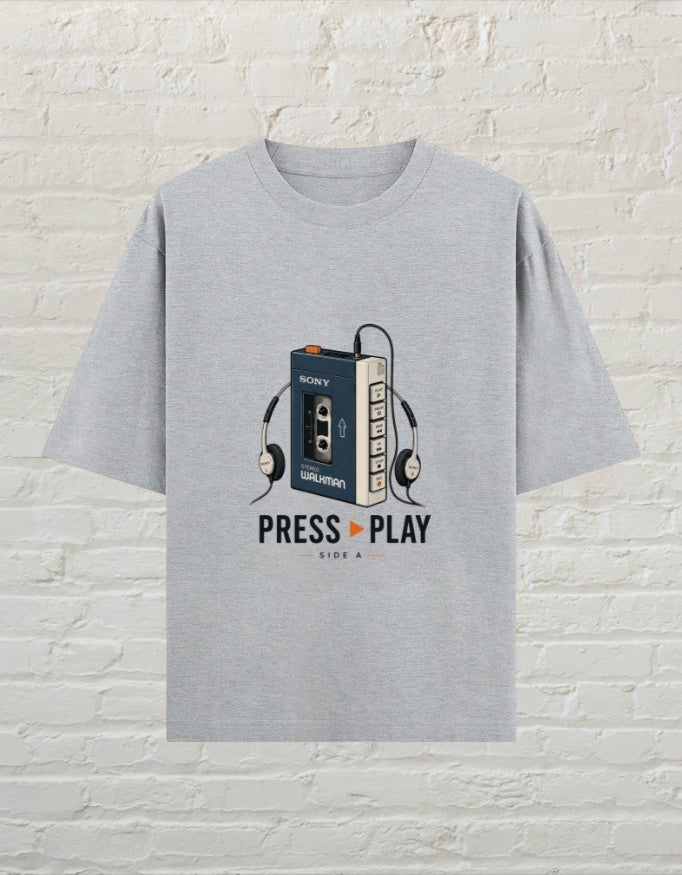 CoreTeez grey melange oversized cotton t-shirt featuring a retro Walkman and headphones graphic with Press Play text