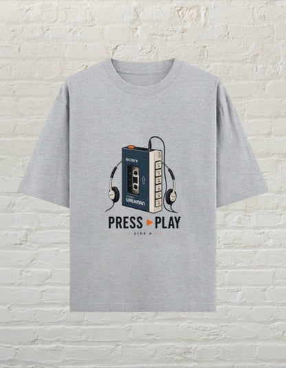 CoreTeez grey melange oversized cotton t-shirt featuring a retro Walkman and headphones graphic with Press Play text