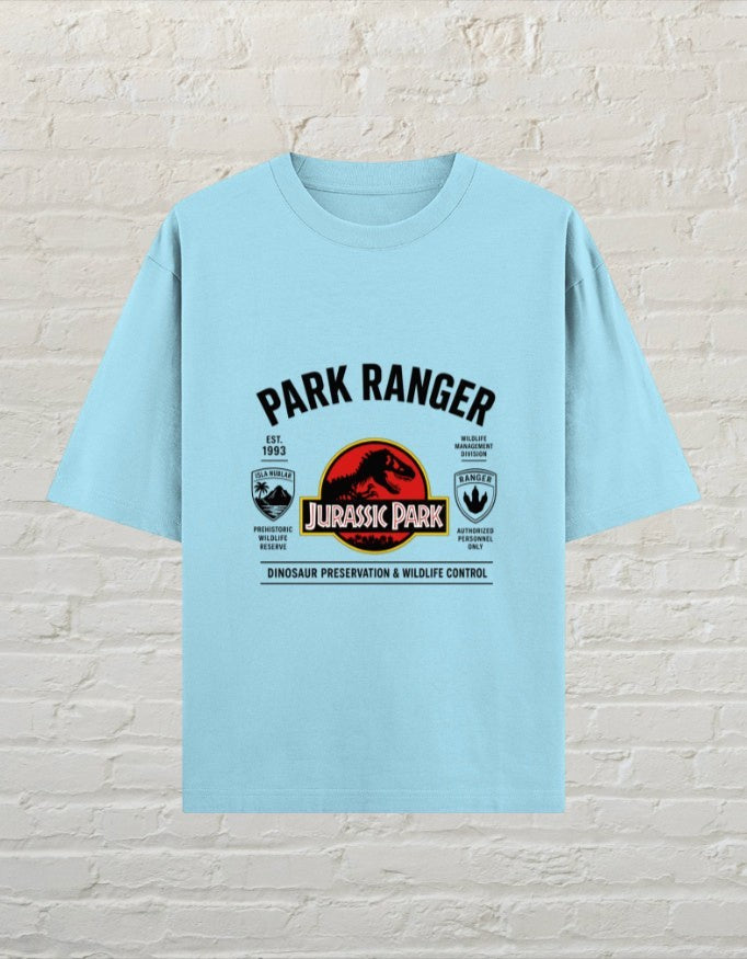 CoreTeez baby blue oversized cotton t-shirt featuring a Jurassic Park dinosaur ranger graphic print.