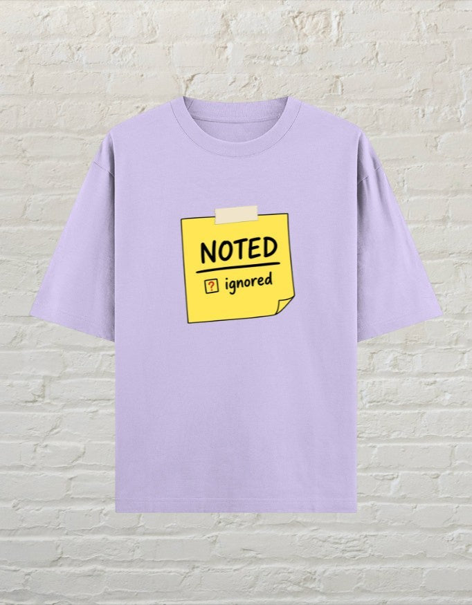 CoreTeez unisex oversized lavender cotton t-shirt featuring a yellow sticky note graphic with Noted and Ignored text.