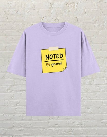 CoreTeez unisex oversized lavender cotton t-shirt featuring a yellow sticky note graphic with Noted and Ignored text.
