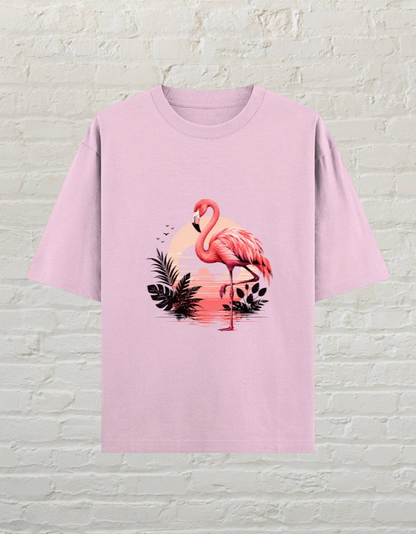 CoreTeez light baby pink oversized cotton t-shirt featuring a tropical flamingo and sunset graphic print.