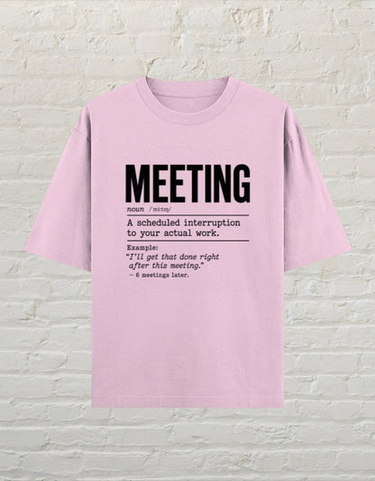 CoreTeez light baby pink oversized cotton t-shirt with a black dictionary-style graphic about office meetings