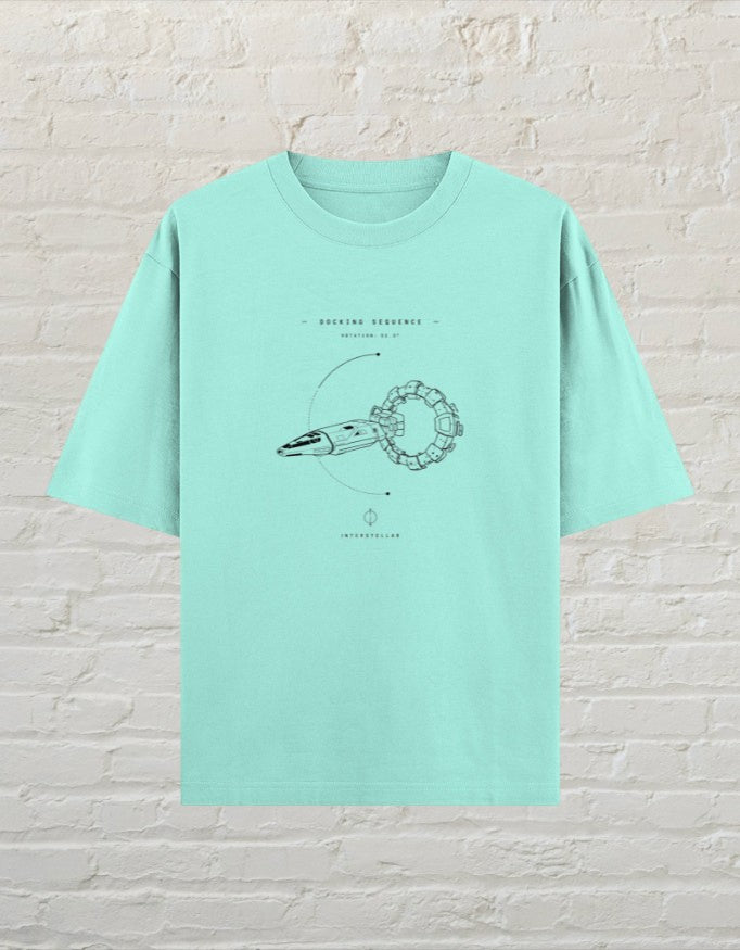 CoreTeez mint oversized cotton t-shirt featuring a Interstellar docking sequence graphic print