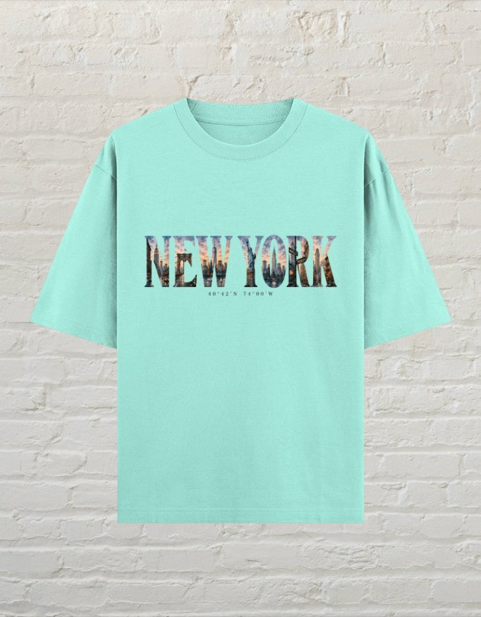 CoreTeez mint oversized cotton t-shirt featuring a New York cityscape graphic print on the chest