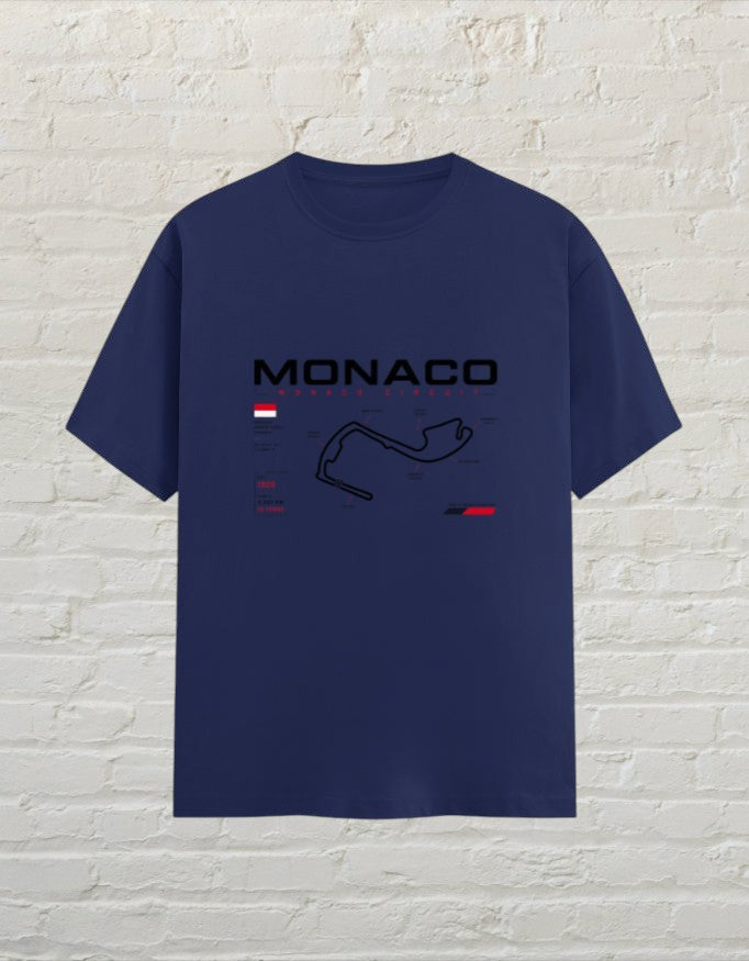CoreTeez royal blue 100% cotton unisex t-shirt featuring a Monaco circuit racing graphic on the chest.