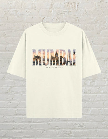 Mumbai travel graphic unisex oversized T-shirt with artistic city typography and sunset-inspired artwork Off White