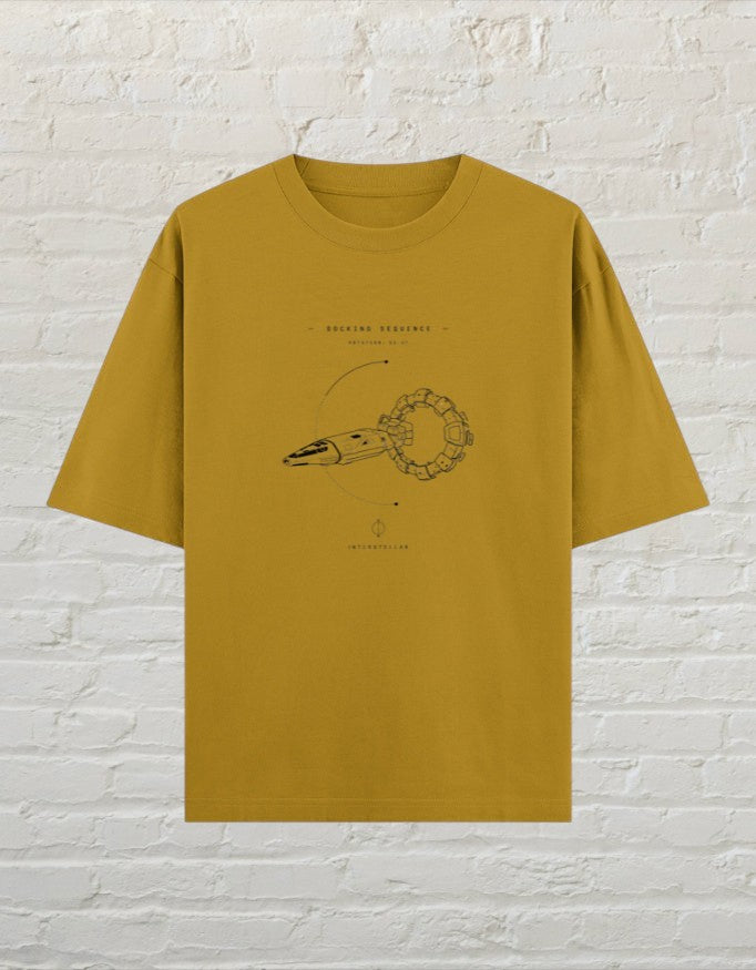 CoreTeez mustard yellow oversized cotton t-shirt featuring a Interstellar docking sequence graphic print