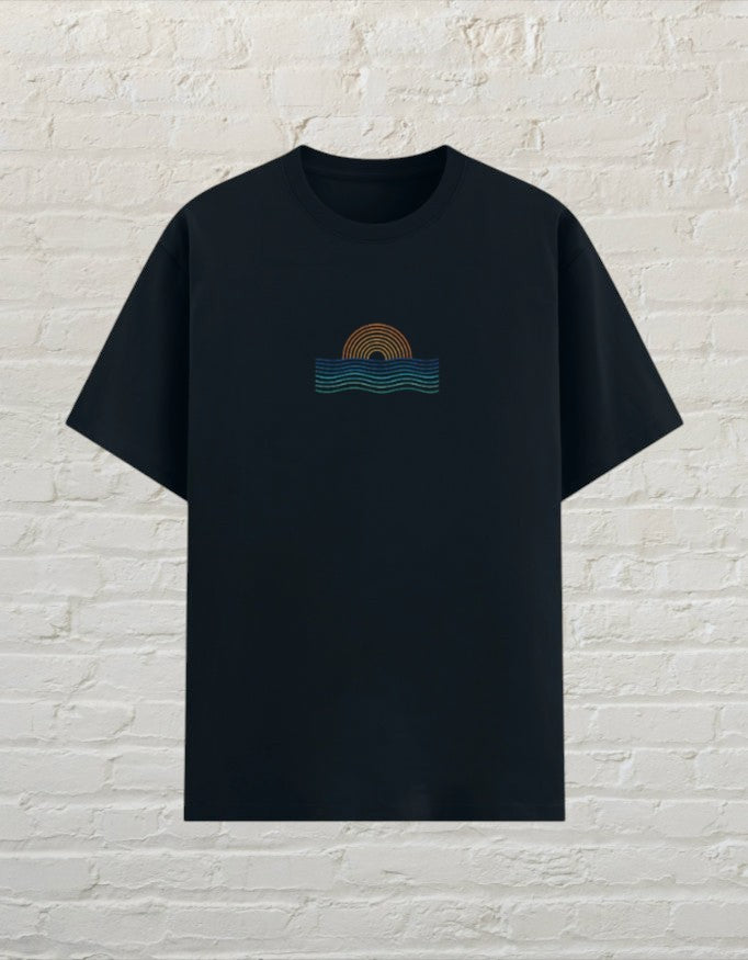 CoreTeez unisex navy blue poly-cotton graphic t-shirt featuring a minimalist sunset and ocean wave design on the chest.