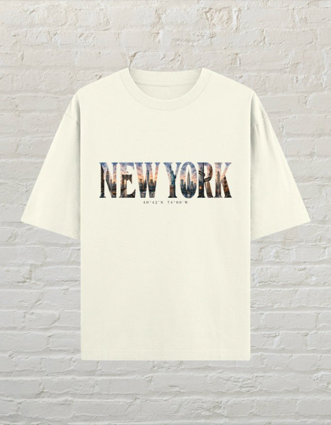 CoreTeez oversized off white cotton t-shirt featuring a New York cityscape graphic print with coordinates.