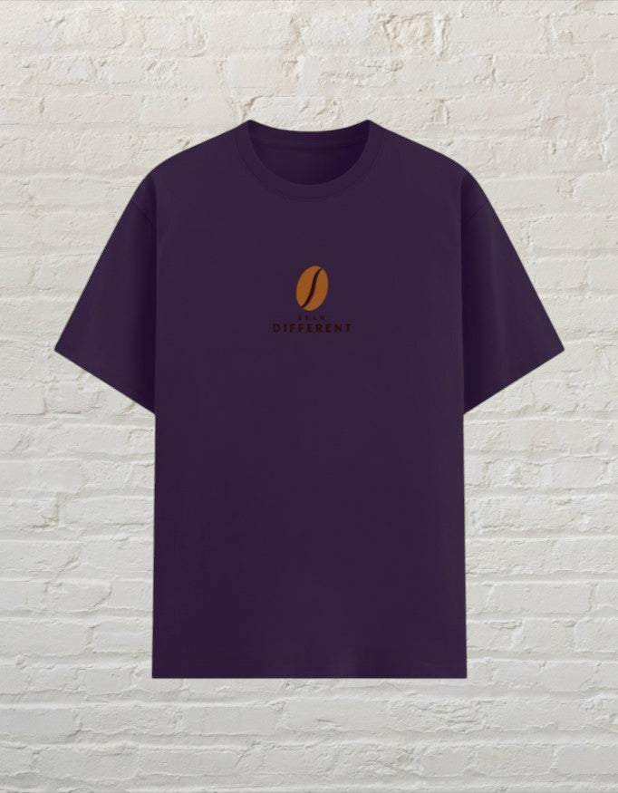CoreTeez unisex purple poly-cotton t-shirt featuring a small brown coffee bean graphic and Bean Different text.