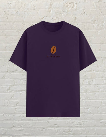 CoreTeez unisex purple poly-cotton t-shirt featuring a small brown coffee bean graphic and Bean Different text.
