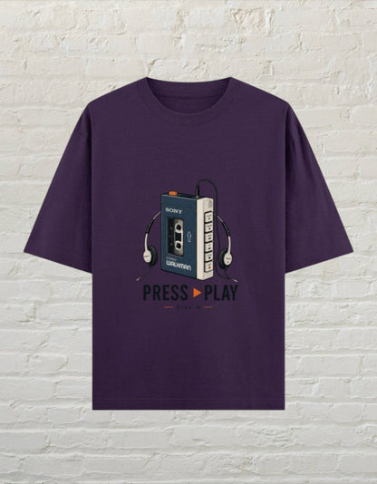 CoreTeez unisex oversized purple cotton t-shirt featuring a vintage Sony Walkman graphic and Press Play text
