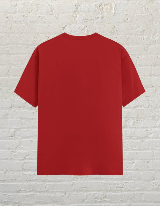 CoreTeez unisex red cotton graphic t-shirt, back view, featuring a plain solid red against a brick wall.
