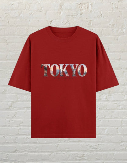 CoreTeez unisex oversized red cotton t-shirt featuring a Tokyo city skyline graphic print on the front.