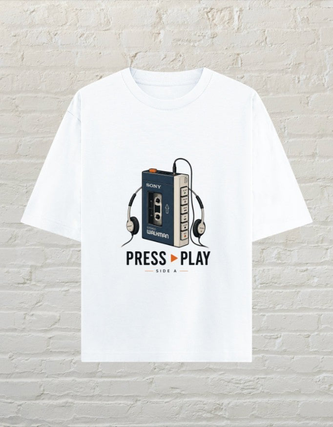 CoreTeez white unisex oversized cotton t-shirt featuring a retro Walkman cassette player graphic and Press Play text