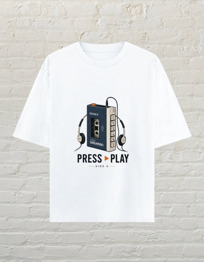 CoreTeez white unisex oversized cotton t-shirt featuring a retro Walkman cassette player graphic and Press Play text